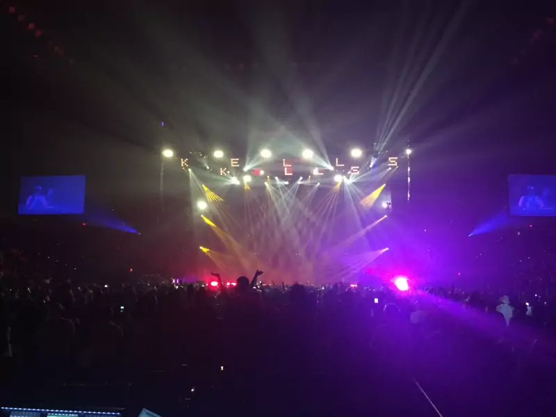 Moving-light beams over a concert crowd