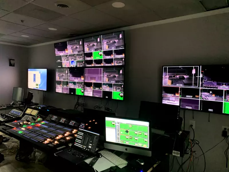 Video control room with a wall of monitors