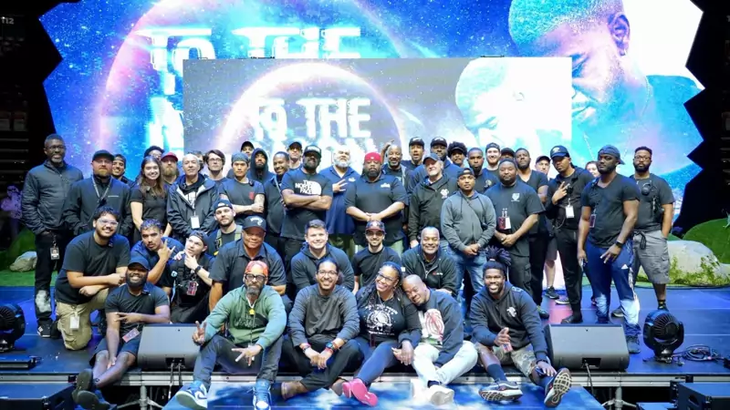 The SR Audio crew on stage in front of an LED wall