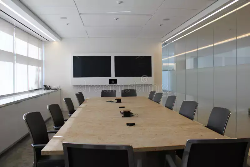 Conference room with a video wall and a long meeting table – an AV installation