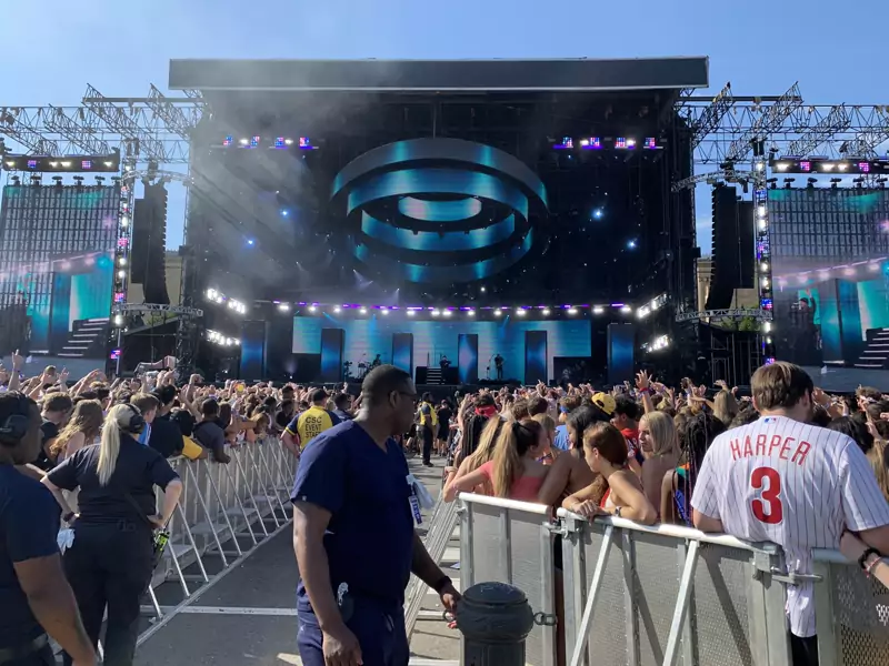 Outdoor festival stage with a large crowd